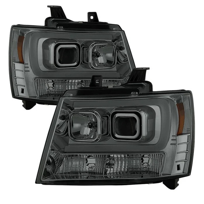 2007-2014 Chevy Suburban 1500/2500 / 2007-2014 Chevy Tahoe / 2007-2014 Avalanche Version 2 Projector Headlights – High H1 (Included) – Low H7 (Included) Light Bar DRL – Smoke